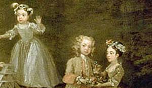 Sisters and a brother at play wearing little adult clothing as children did in the 18th century.